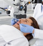Male patient having professional dental treatment in modern cabinet, cropped